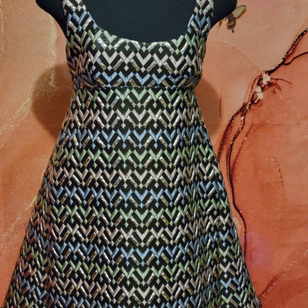 Milly accented gold and colors.